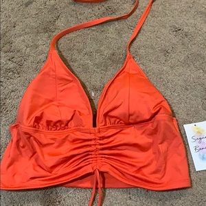 Swimsuit top by Sugar Beach
